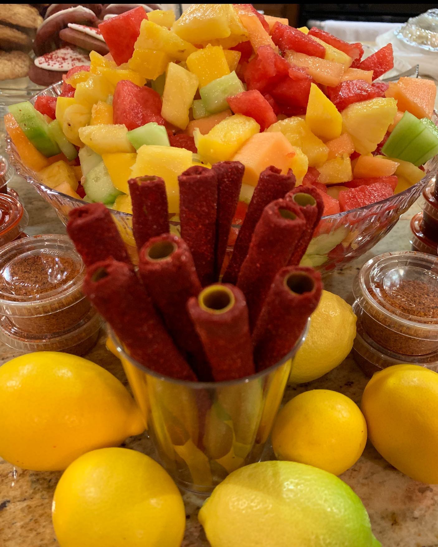 Large bowl of mixed fruit with toppings